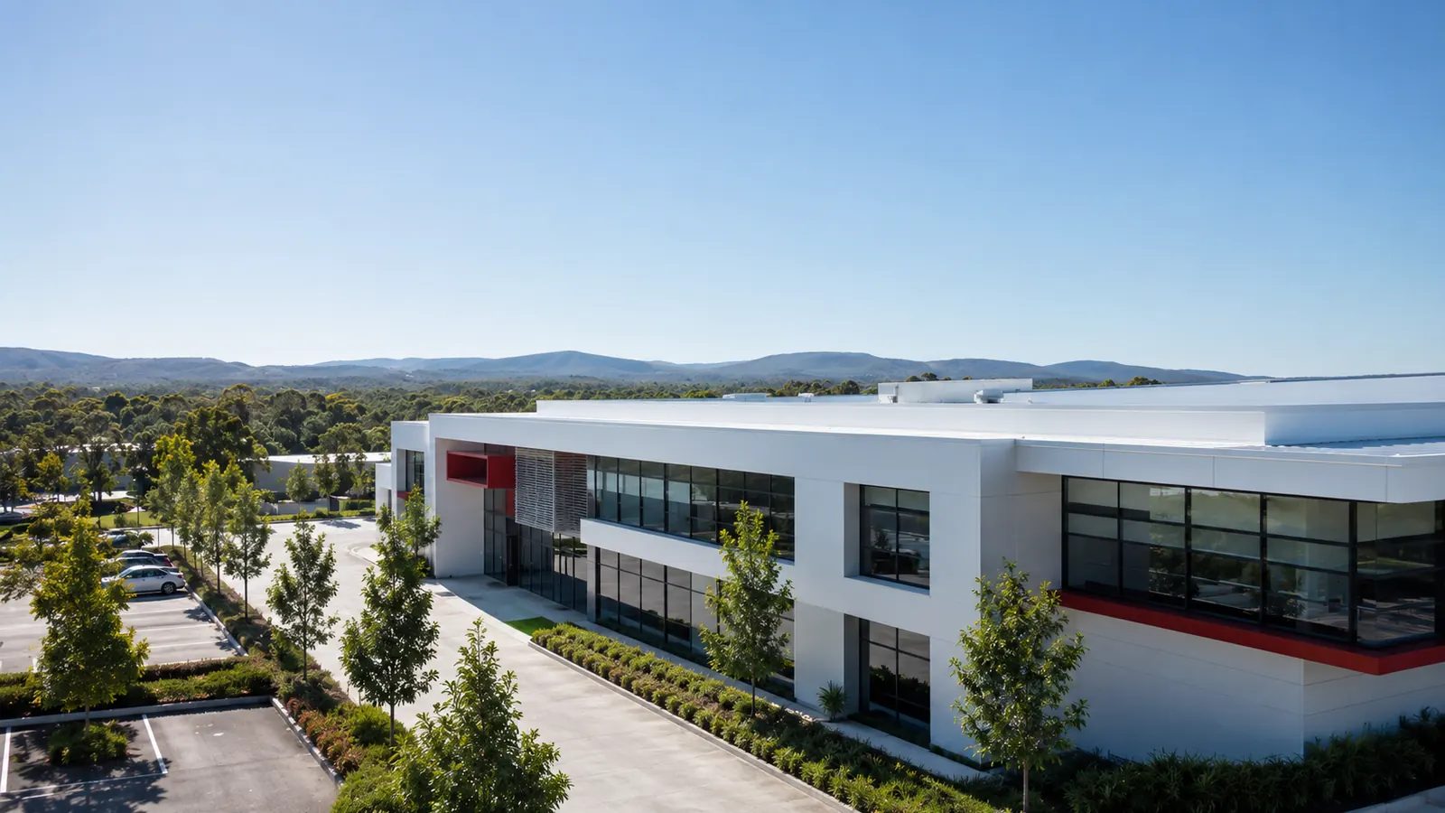 Modern commercial office building with a light-coloured exterior, illustrating a NusCoolWall™ application scenario