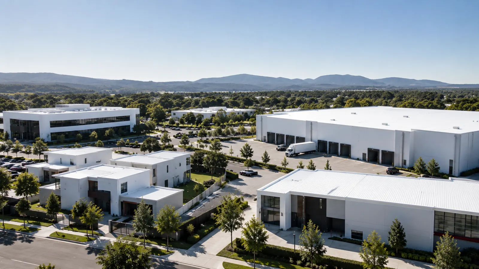 Aerial view of a mixed business park with commercial, warehouse and residential buildings